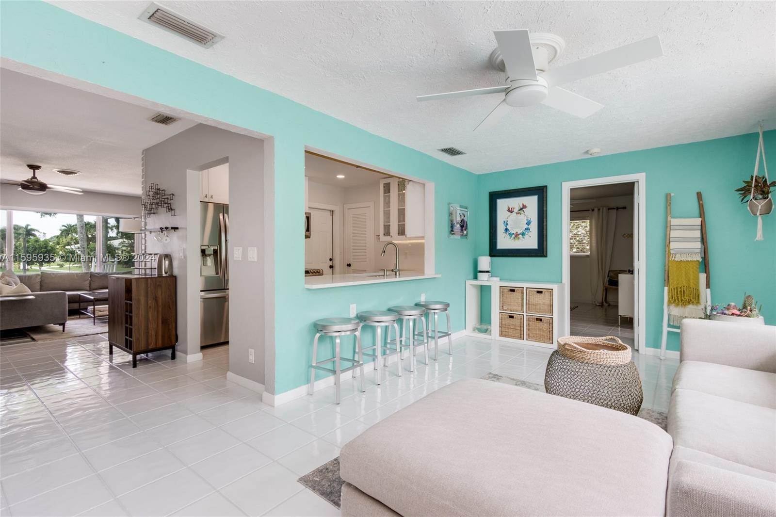 20 Burning Tree Lane Boca Raton, FL 33431 - Photo 25 of 64 a living room with furniture and a chandelier