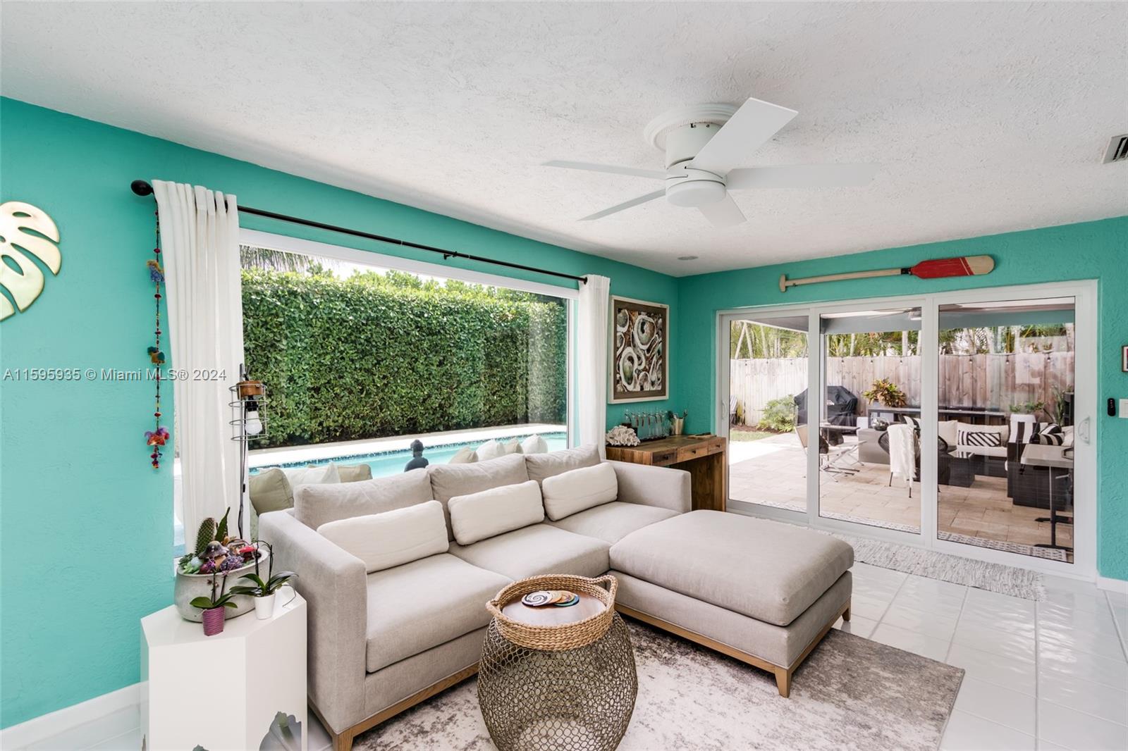 20 Burning Tree Lane Boca Raton, FL 33431 - Photo 26 of 64 a living room with furniture and a large window