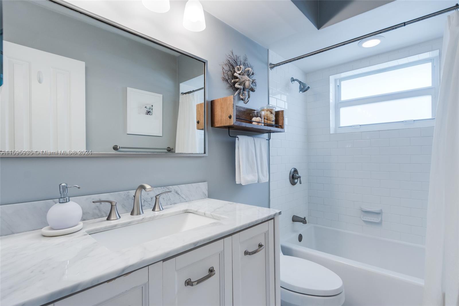 20 Burning Tree Lane Boca Raton, FL 33431 - Photo 39 of 64 a bathroom with a granite countertop sink mirror toilet and bathtub