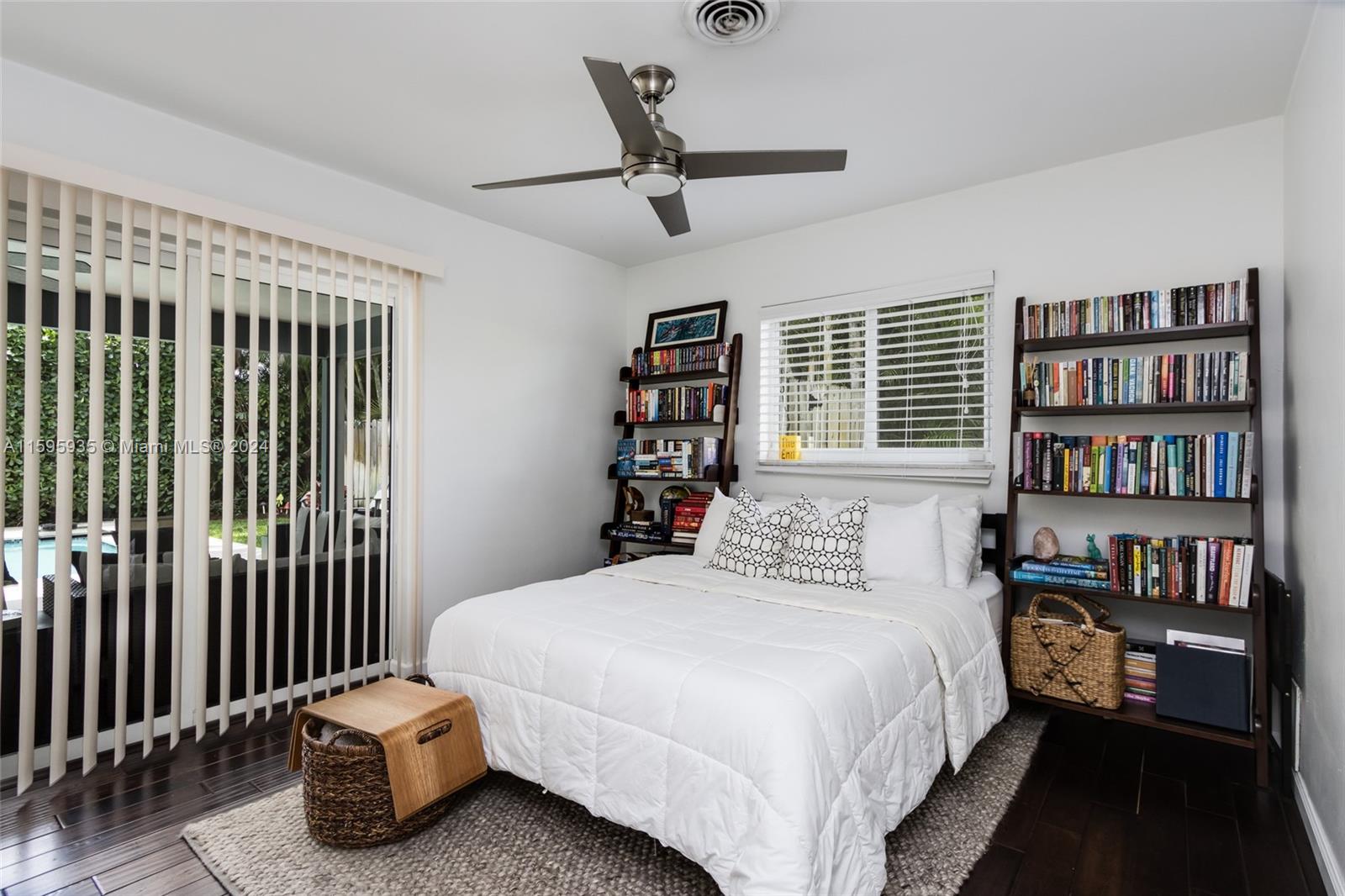 20 Burning Tree Lane Boca Raton, FL 33431 - Photo 40 of 64 a bedroom with a bed furniture and a book shelf