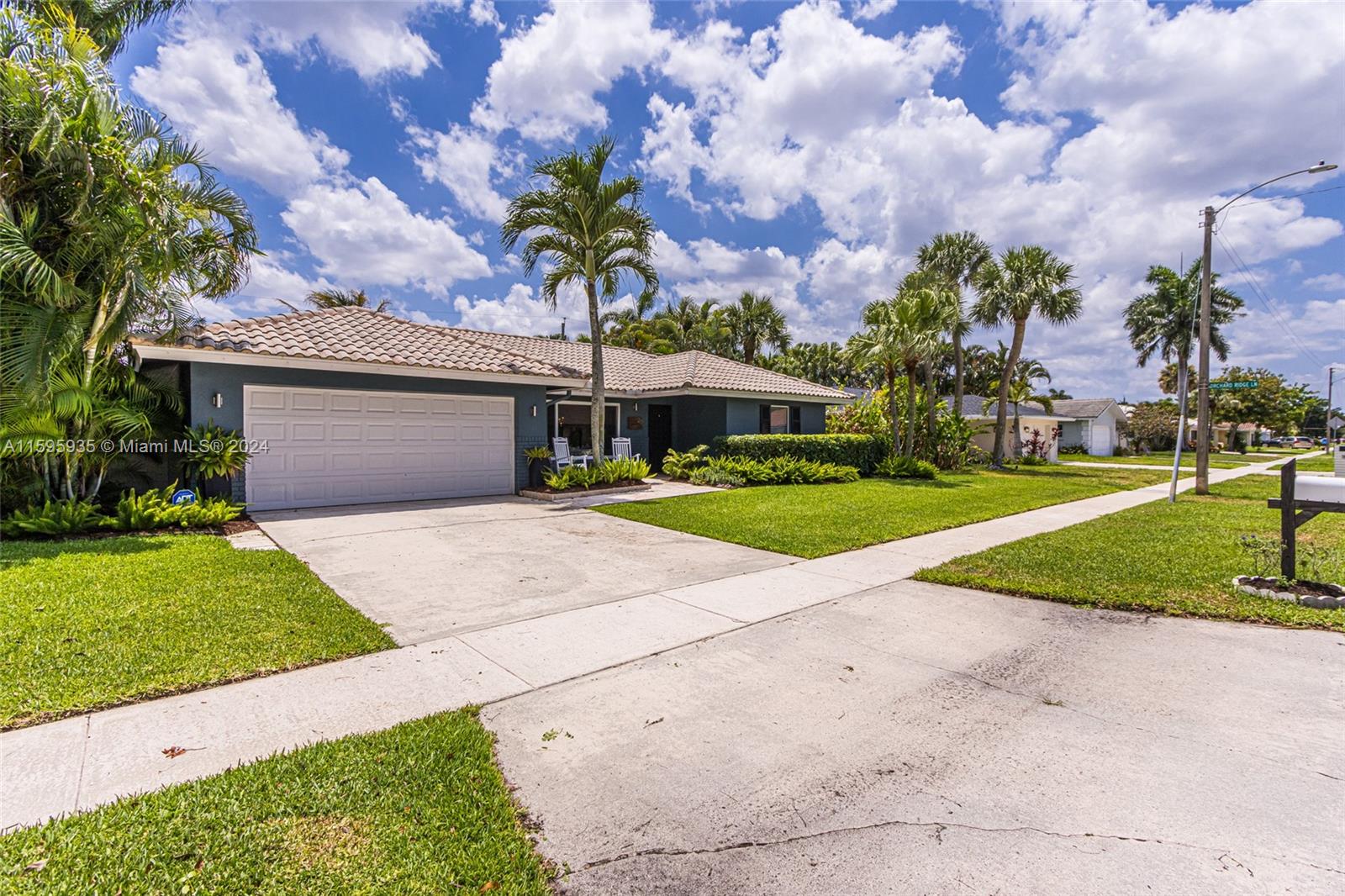 20 Burning Tree Lane Boca Raton, FL 33431 - Photo 4 of 64 a front view of a house with garden