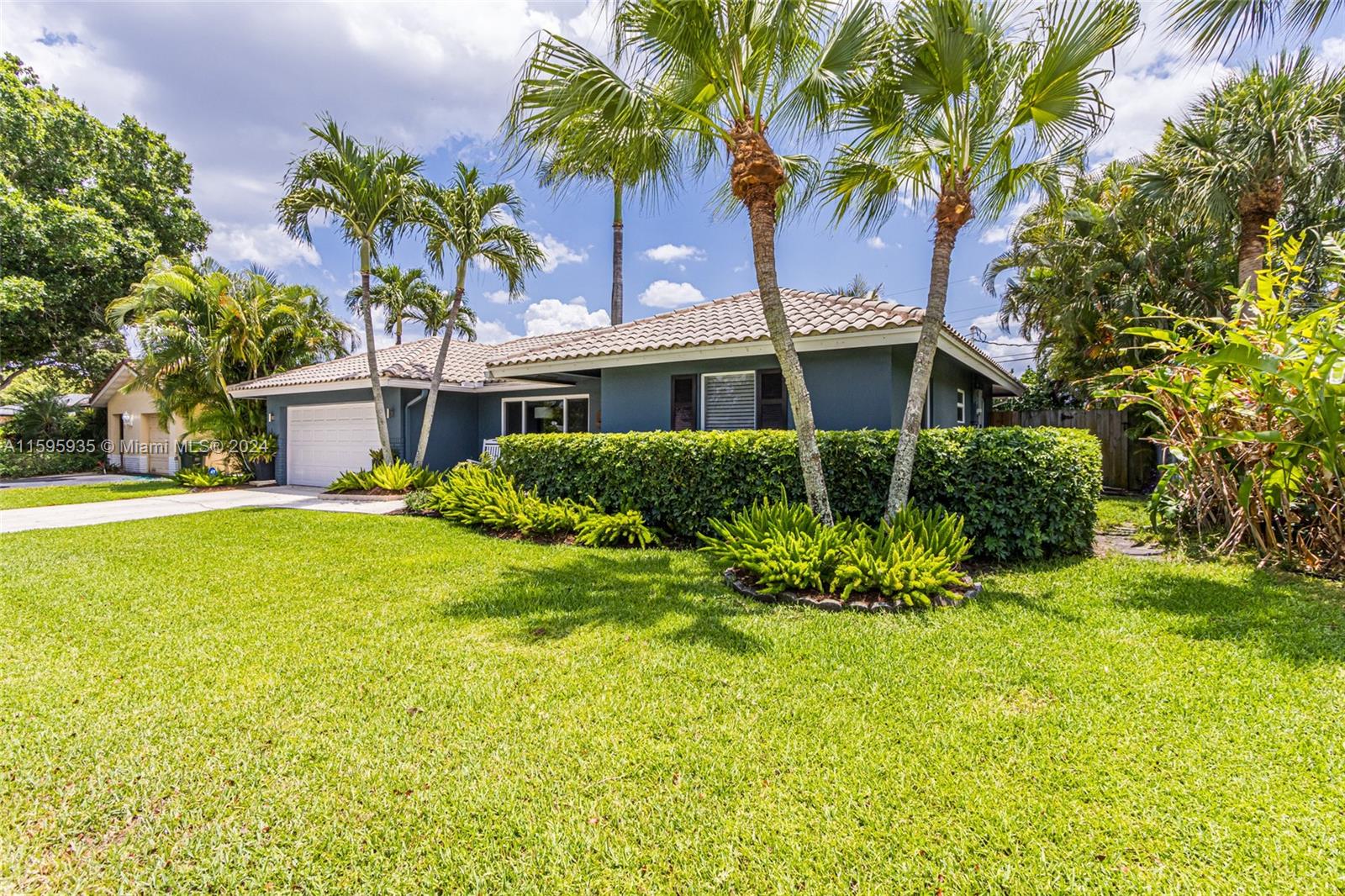 20 Burning Tree Lane Boca Raton, FL 33431 - Photo 6 of 64 a front view of a house with a yard