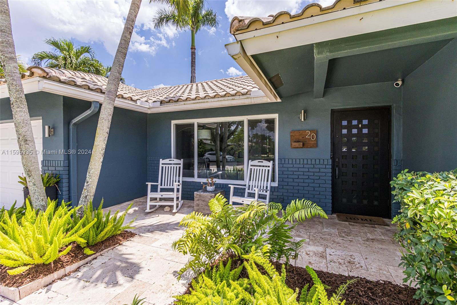 20 Burning Tree Lane Boca Raton, FL 33431 - Photo 7 of 64 a front view of a house with garden