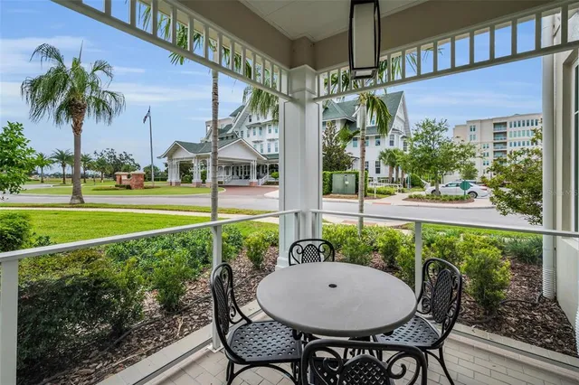 a kitchen with white cabinets and appliances