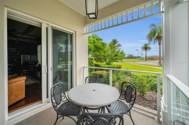 a kitchen with kitchen island granite countertop appliances cabinets and a sink