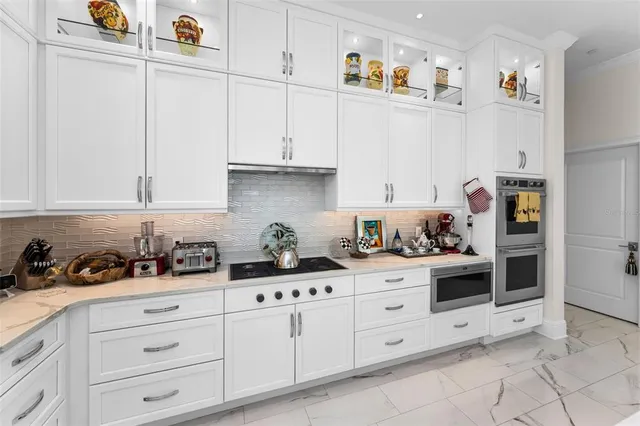 a kitchen with a sink cabinets and appliances