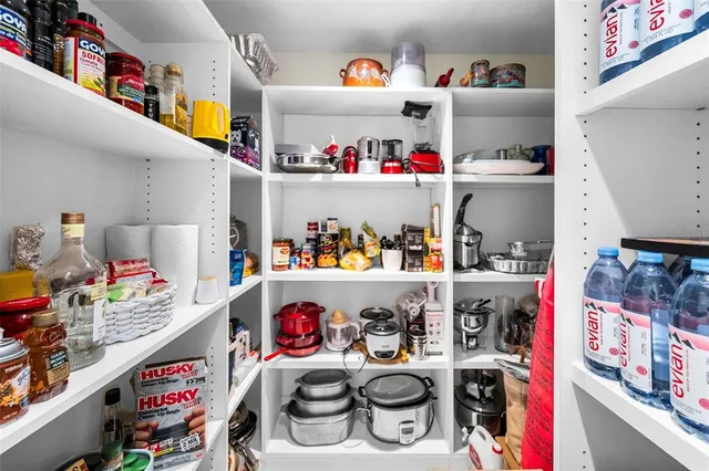 a bedroom with a bed window and table