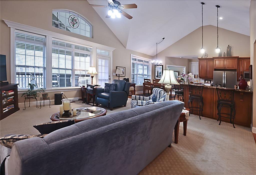 42 Crooked Branch Road Clayton, GA 30525 - Photo 14 of 48 a living room with furniture kitchen and a chandelier