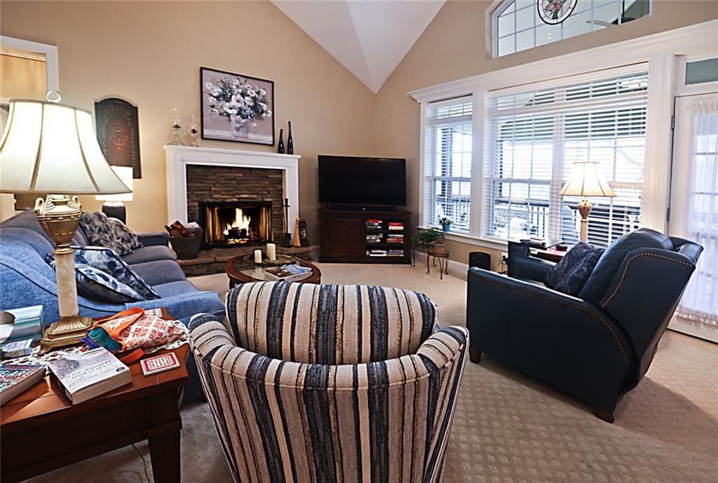 42 Crooked Branch Road Clayton, GA 30525 - Photo 15 of 48 a living room with furniture fireplace and a flat screen tv