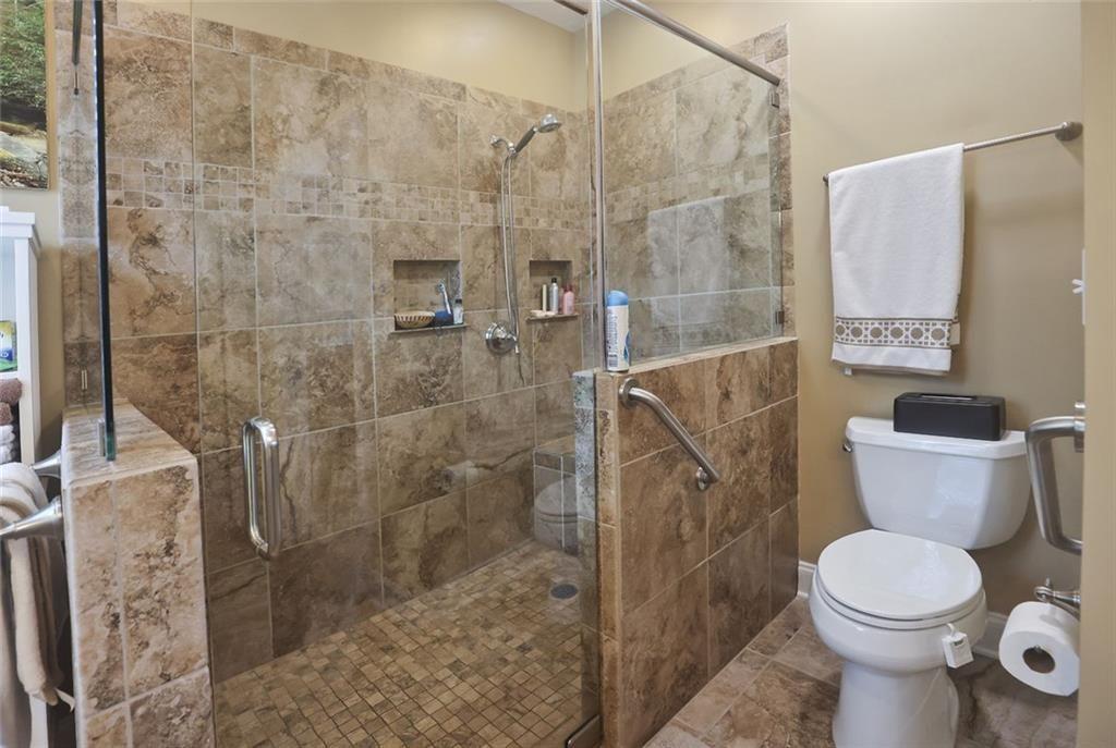 42 Crooked Branch Road Clayton, GA 30525 - Photo 19 of 48 a bathroom with a toilet and a shower