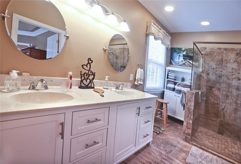 42 Crooked Branch Road Clayton, GA 30525 - Photo 20 of 48 a bathroom with a double vanity sink and a mirror