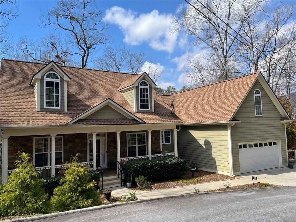 42 Crooked Branch Road Clayton, GA 30525 - Photo 2 of 48 a front view of a house with a garden and yard