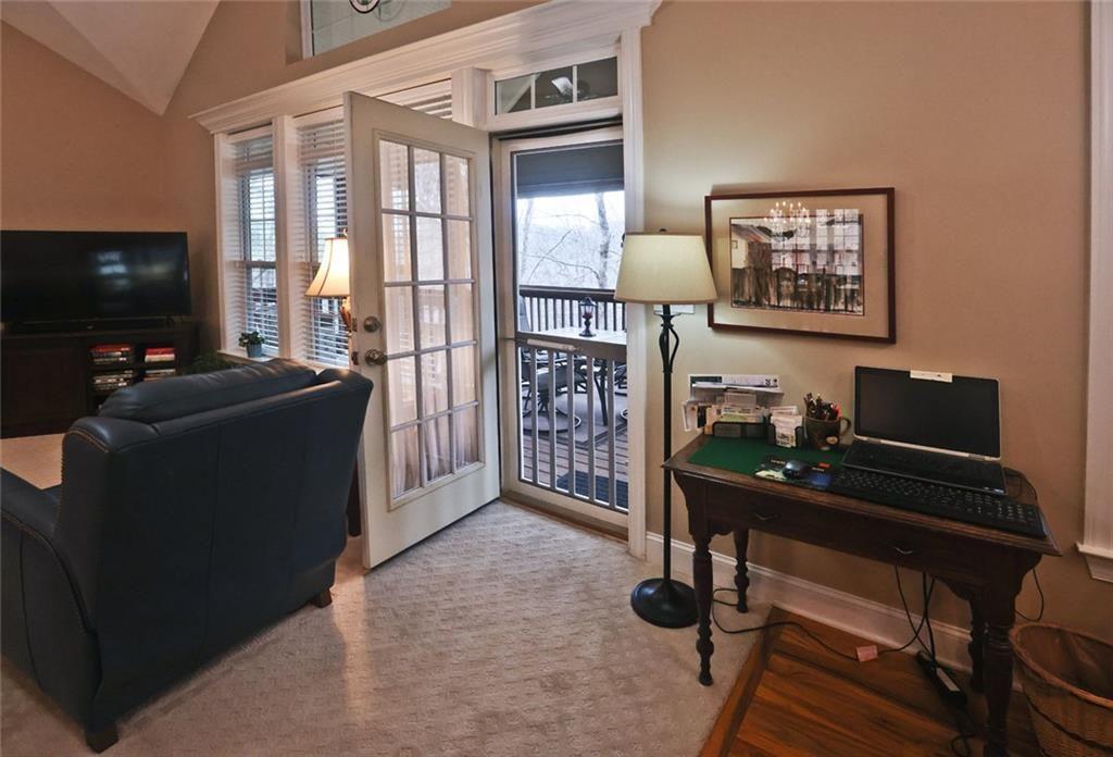 42 Crooked Branch Road Clayton, GA 30525 - Photo 26 of 48 a living room with furniture and a flat screen tv