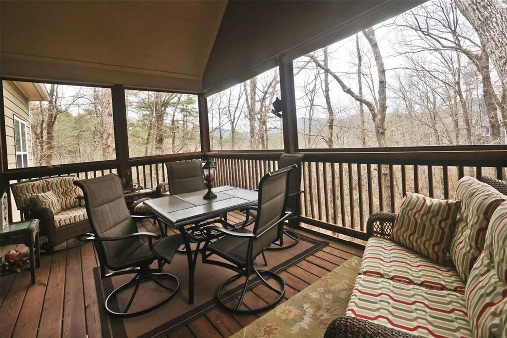 42 Crooked Branch Road Clayton, GA 30525 - Photo 27 of 48 a view of a balcony with furniture and wooden floor