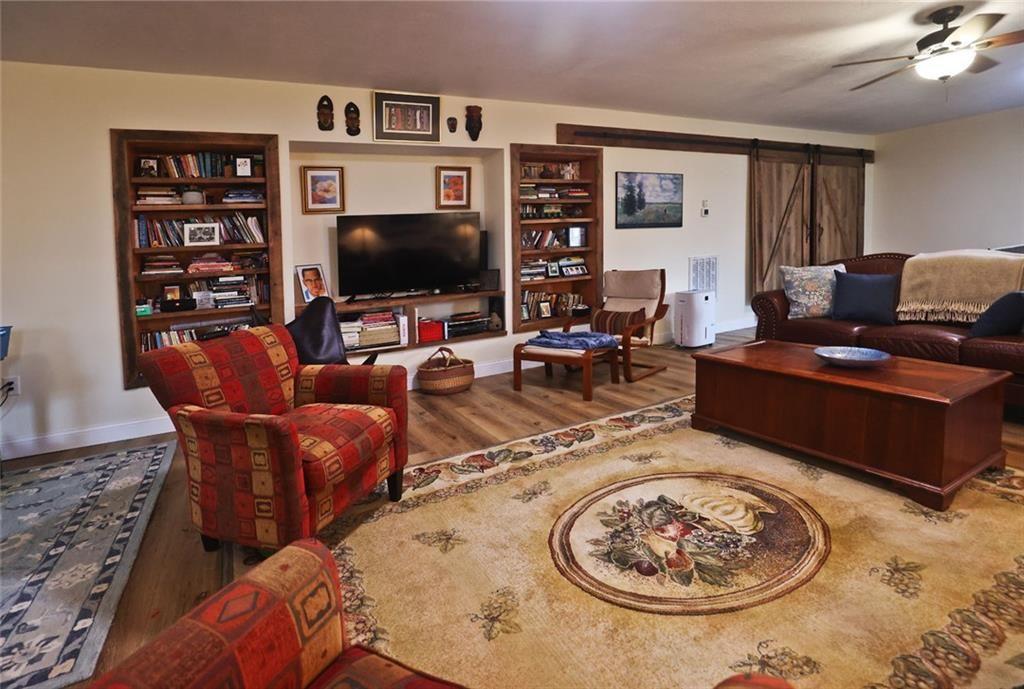 42 Crooked Branch Road Clayton, GA 30525 - Photo 37 of 48 a living room with furniture a rug and a flat screen tv