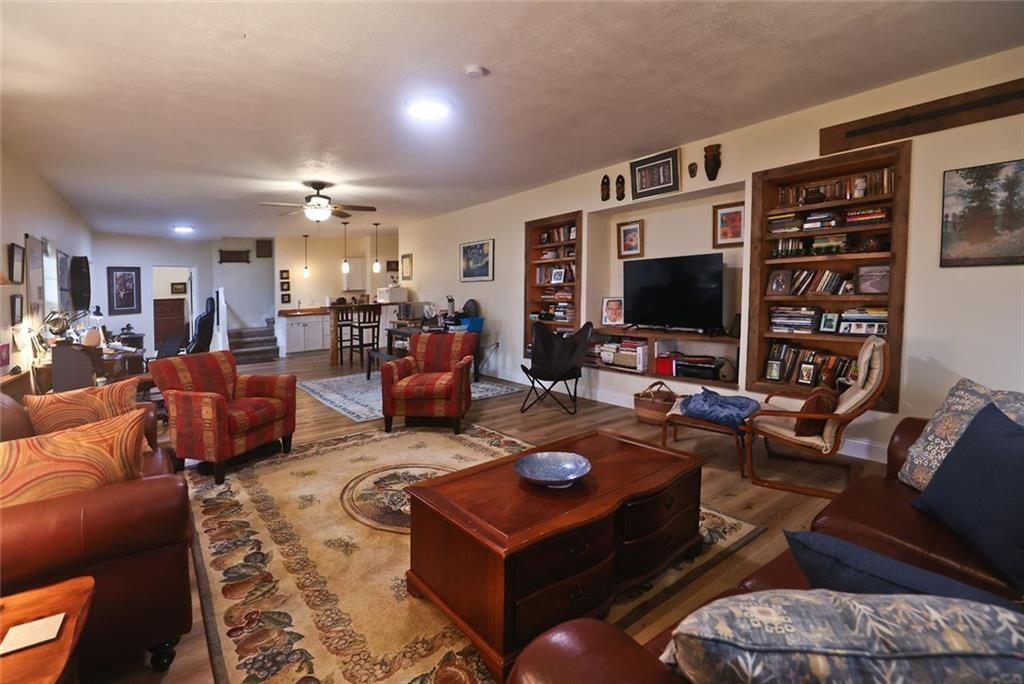 42 Crooked Branch Road Clayton, GA 30525 - Photo 38 of 48 a living room with furniture and a flat screen tv