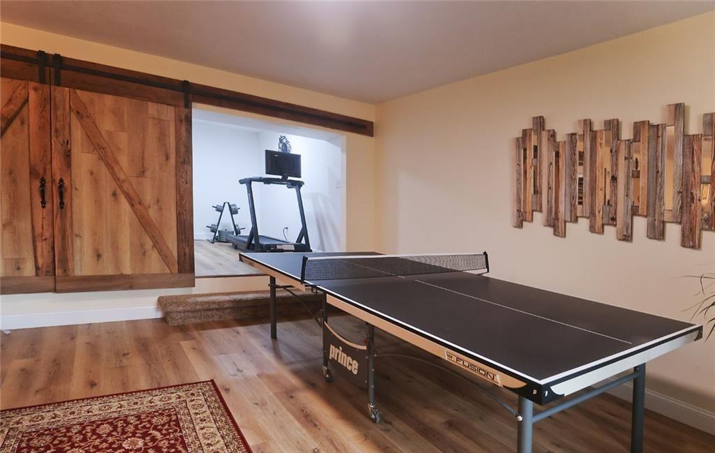 42 Crooked Branch Road Clayton, GA 30525 - Photo 39 of 48 a room with pool table and a chandelier