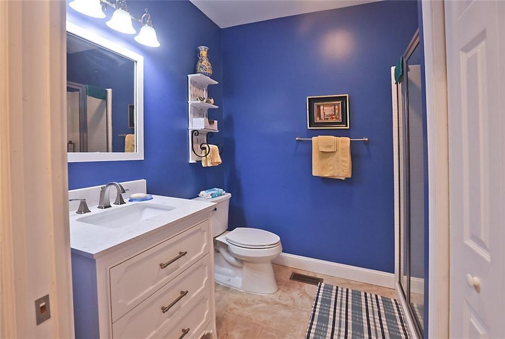 42 Crooked Branch Road Clayton, GA 30525 - Photo 42 of 48 a bathroom with a sink a toilet and mirror