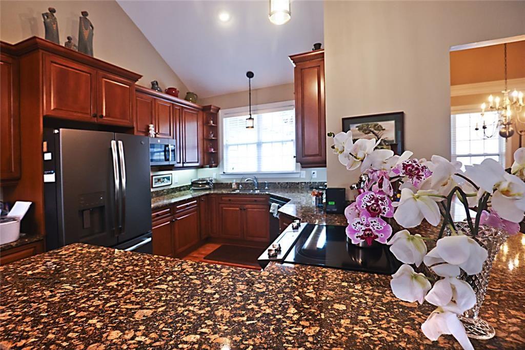 42 Crooked Branch Road Clayton, GA 30525 - Photo 10 of 48 a kitchen with stainless steel appliances a stove a refrigerator and a sink