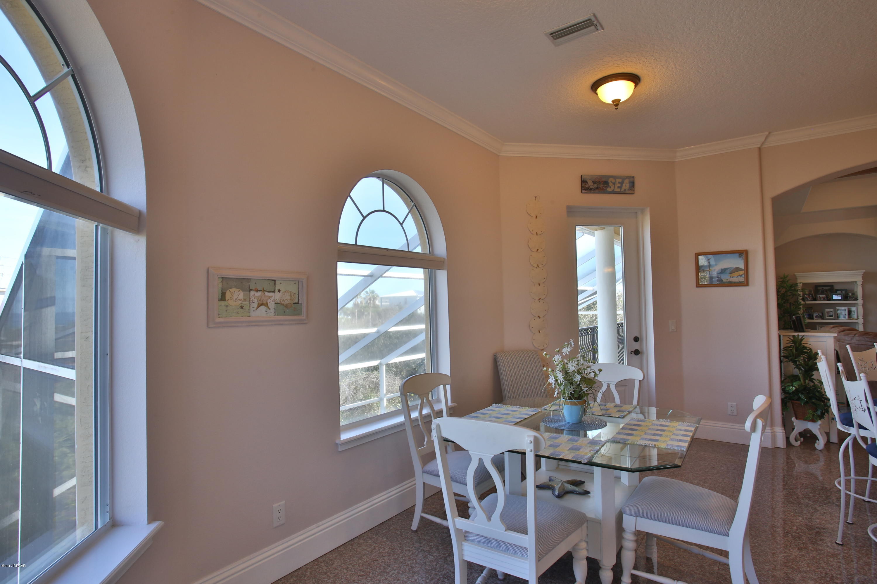 3 Mar Azul South Ponce Inlet, FL 32127 - Photo 13 of 36 a view of a dining room with furniture and window