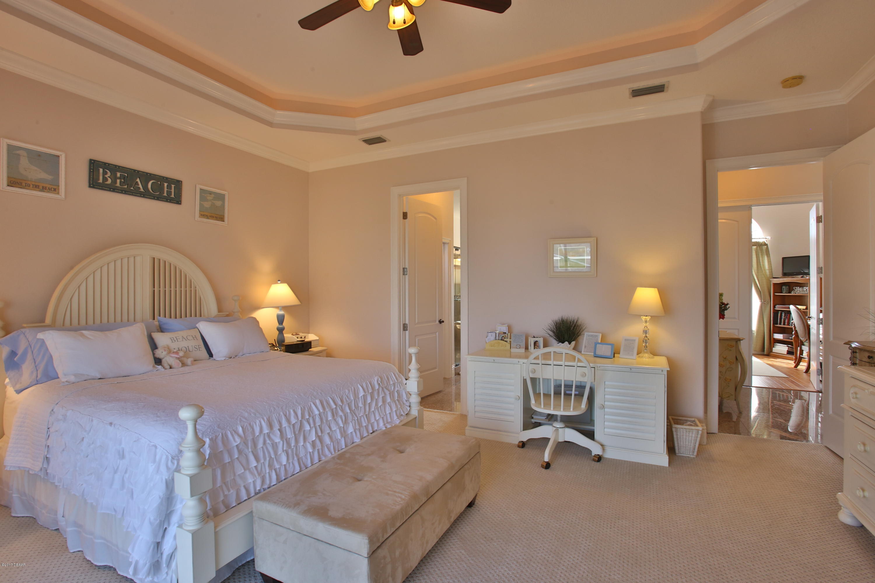 3 Mar Azul South Ponce Inlet, FL 32127 - Photo 18 of 36 a bedroom with a bed a table and painting on the wall