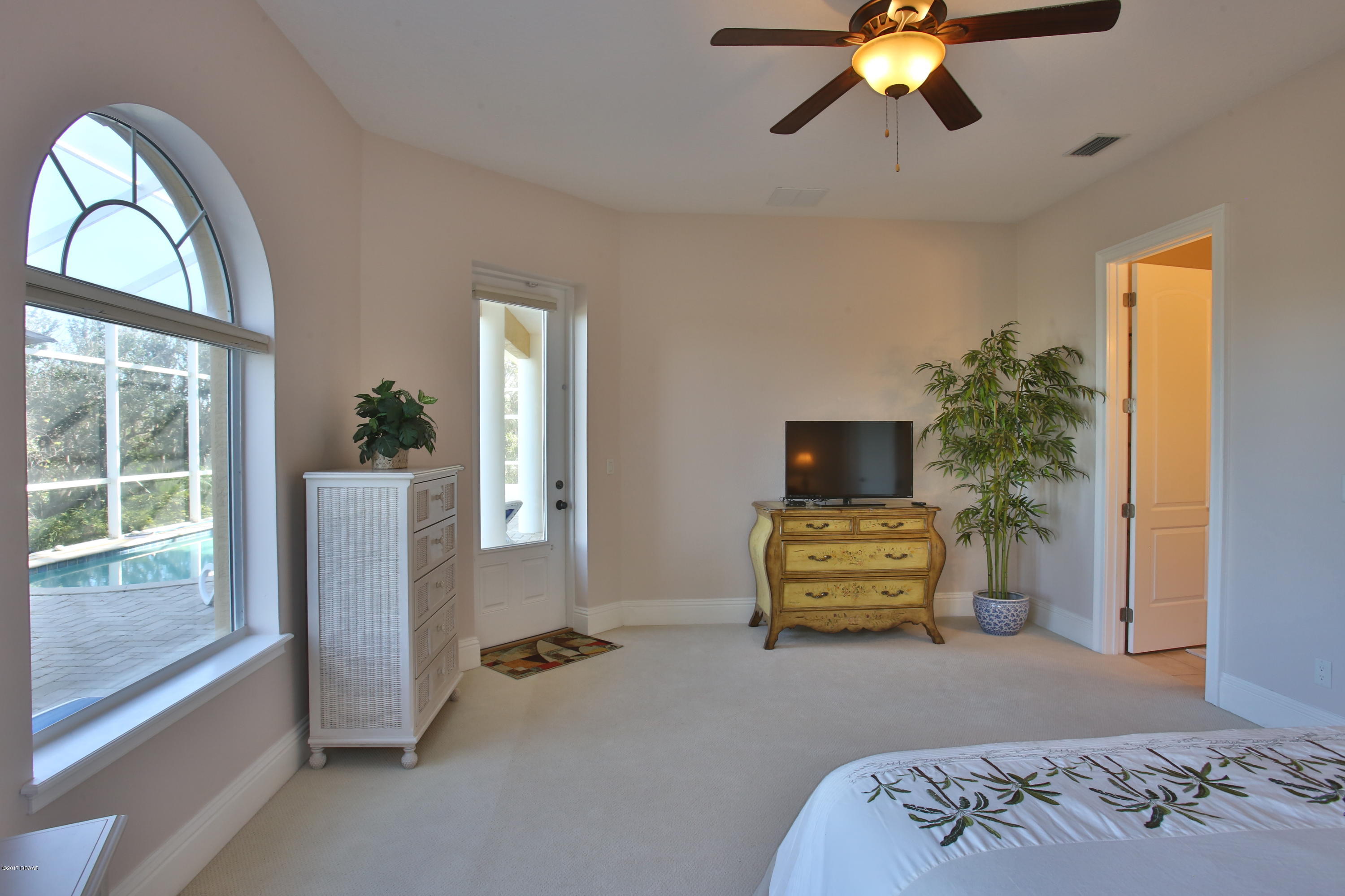 3 Mar Azul South Ponce Inlet, FL 32127 - Photo 24 of 36 a bedroom with a bed and a window