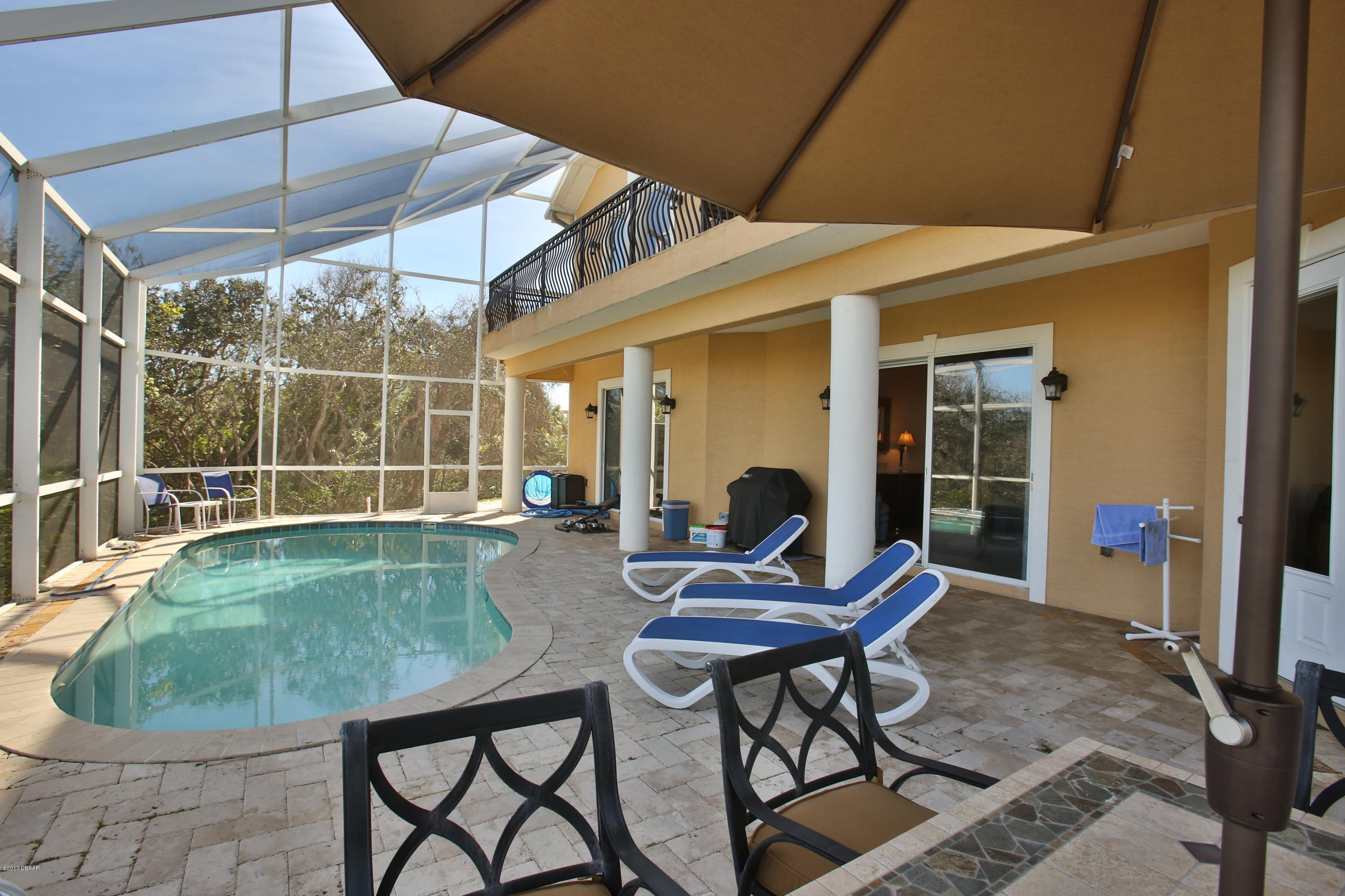 3 Mar Azul South Ponce Inlet, FL 32127 - Photo 31 of 36 a backyard of a house with table and chairs
