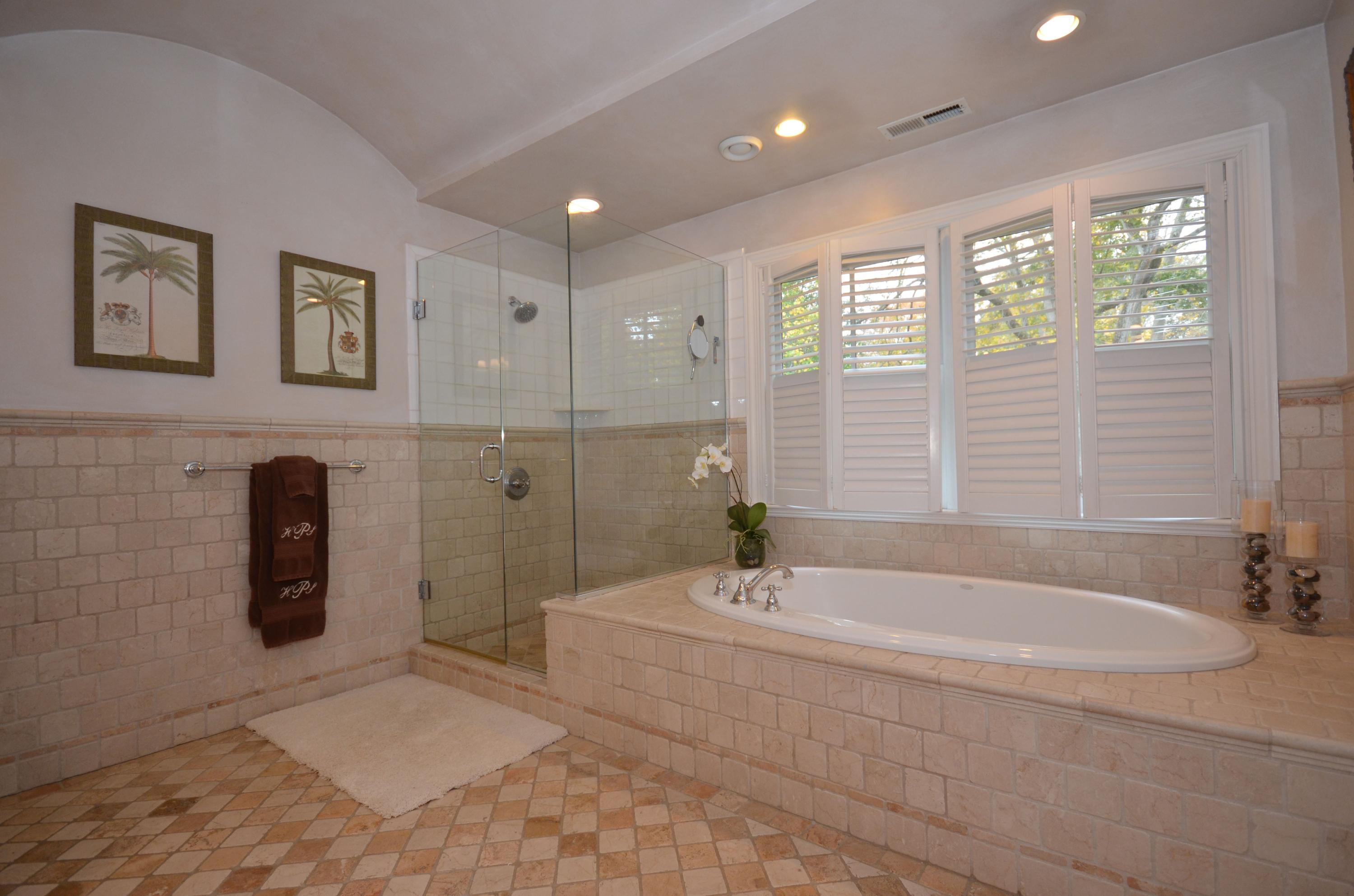 45 Brookside Road Darien, CT 06820 - Photo 14 of 24 a spacious bathroom with a tub a sink and shower
