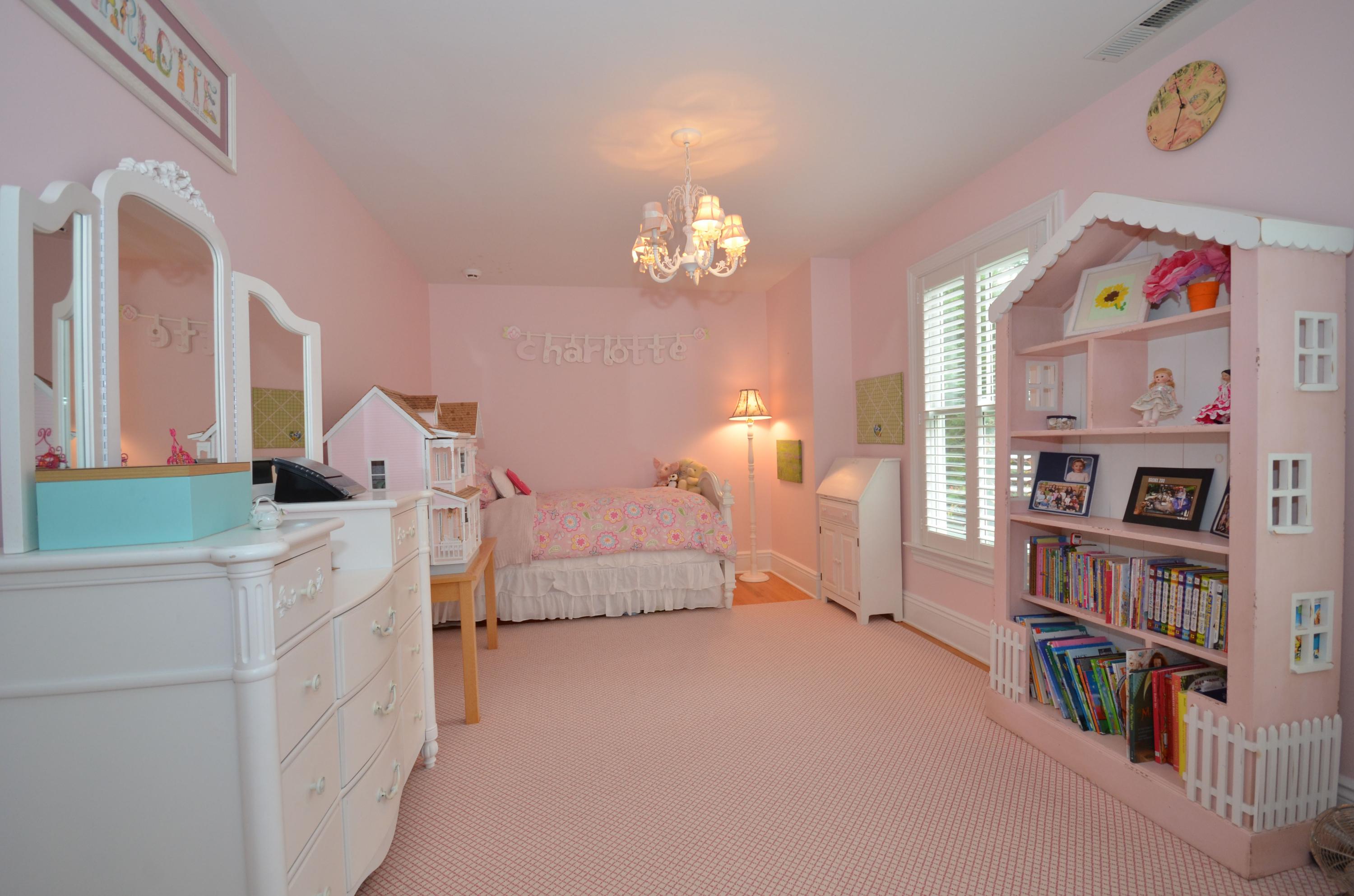 45 Brookside Road Darien, CT 06820 - Photo 15 of 24 a spacious bedroom with a bed and a book shelf