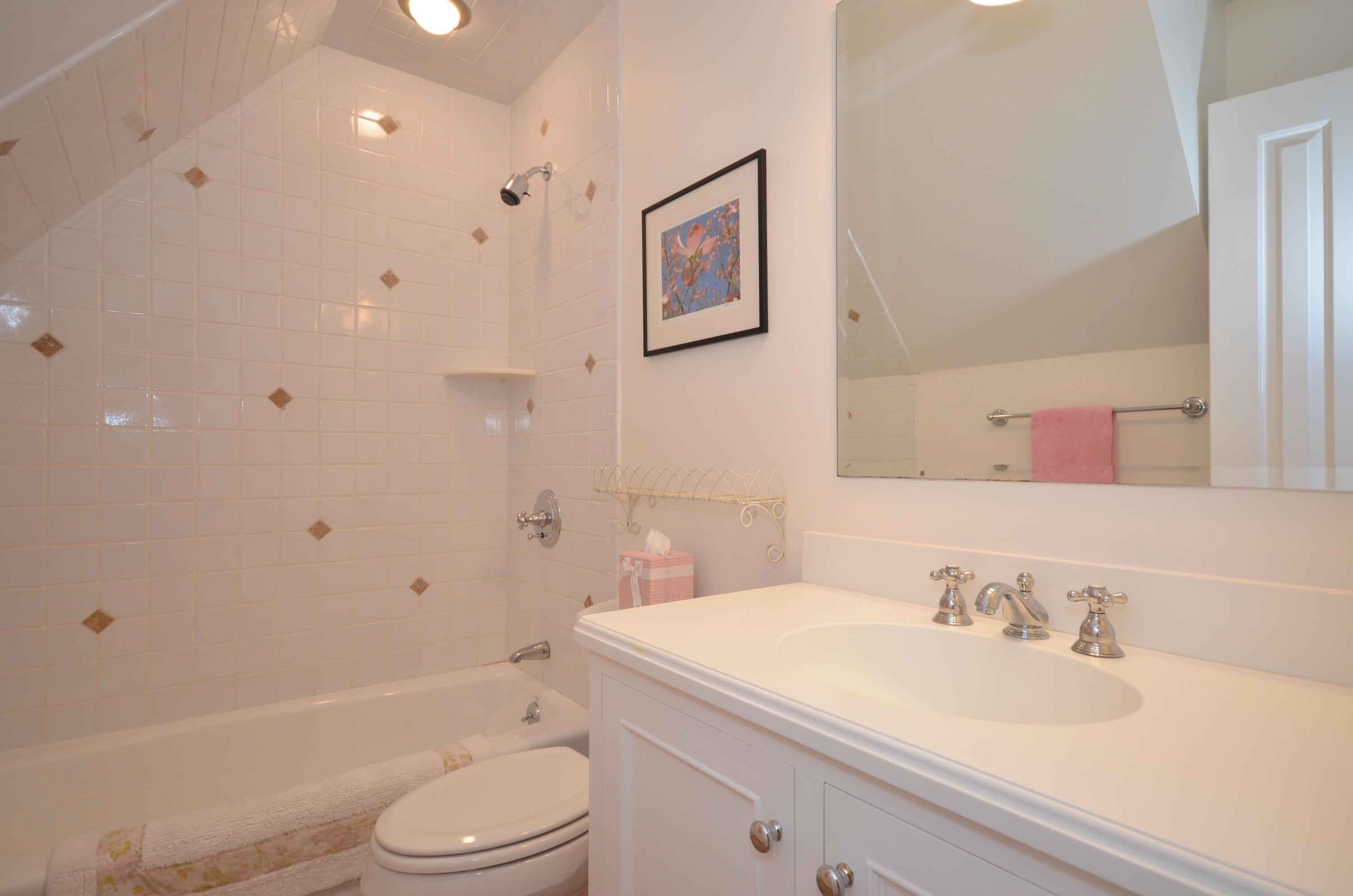 45 Brookside Road Darien, CT 06820 - Photo 16 of 24 a bathroom with a granite countertop sink toilet a mirror and shower
