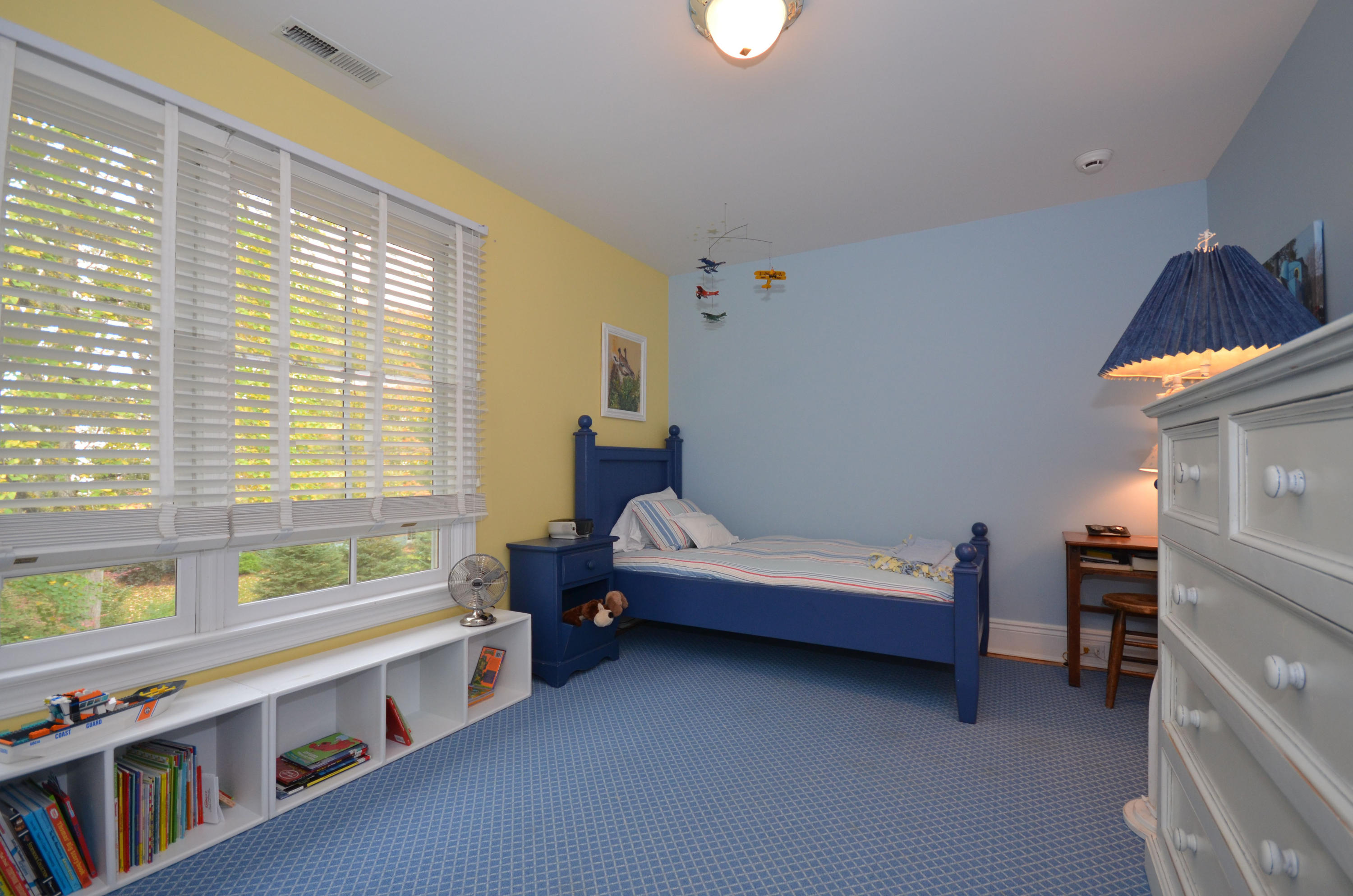 45 Brookside Road Darien, CT 06820 - Photo 19 of 24 a bedroom with furniture and a window