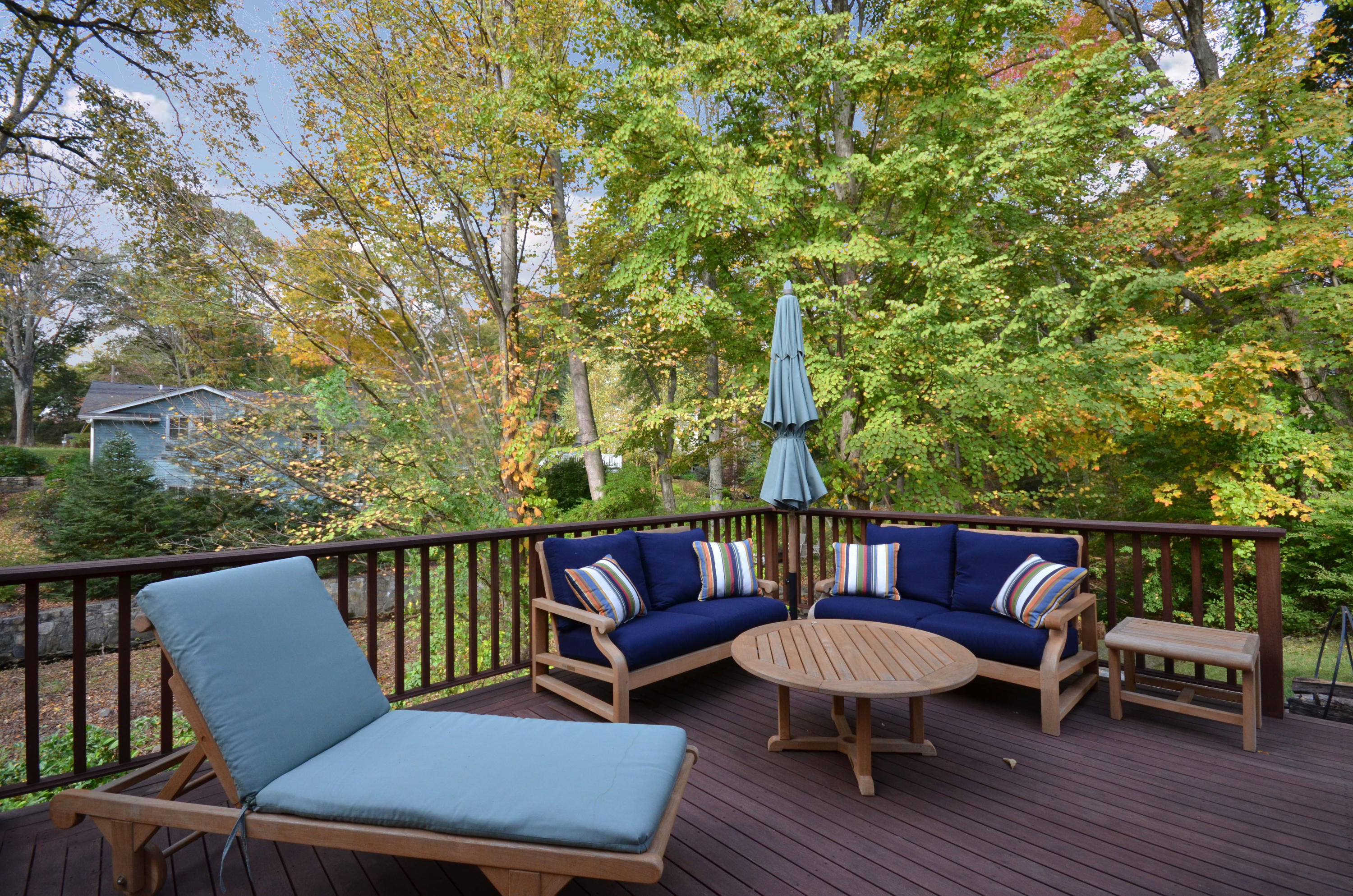 45 Brookside Road Darien, CT 06820 - Photo 22 of 24 a view of a chair and table on the deck