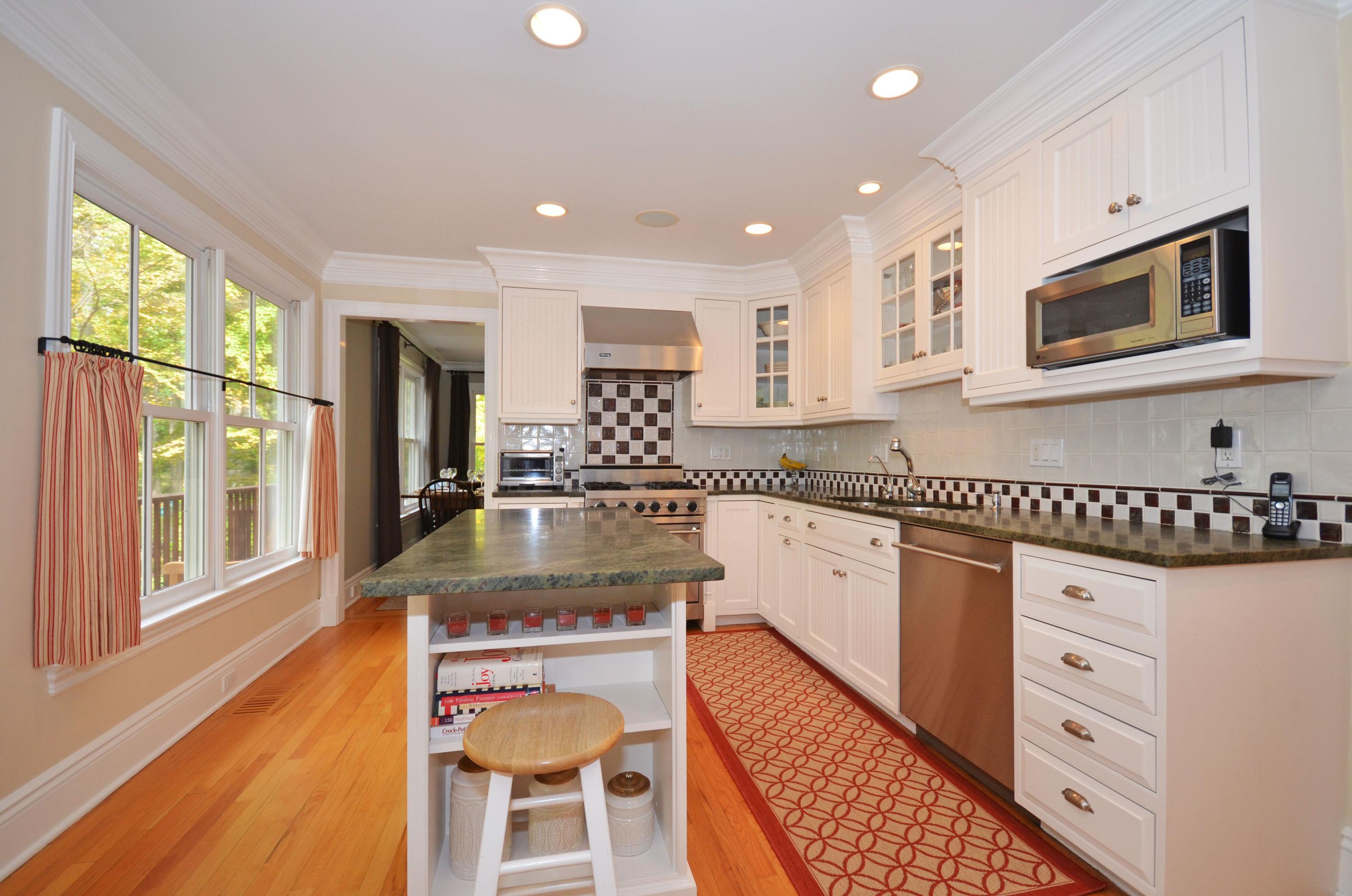 45 Brookside Road Darien, CT 06820 - Photo 8 of 24 a kitchen with stainless steel appliances granite countertop a stove a sink and a microwave