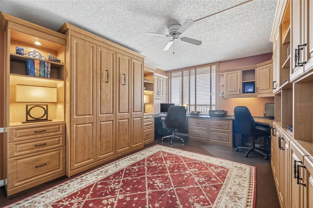 9425 Blind Pass Road, Unit 705 St. Pete Beach, FL 33706 - Photo 28 of 66 a view of a livingroom with furniture and a rug