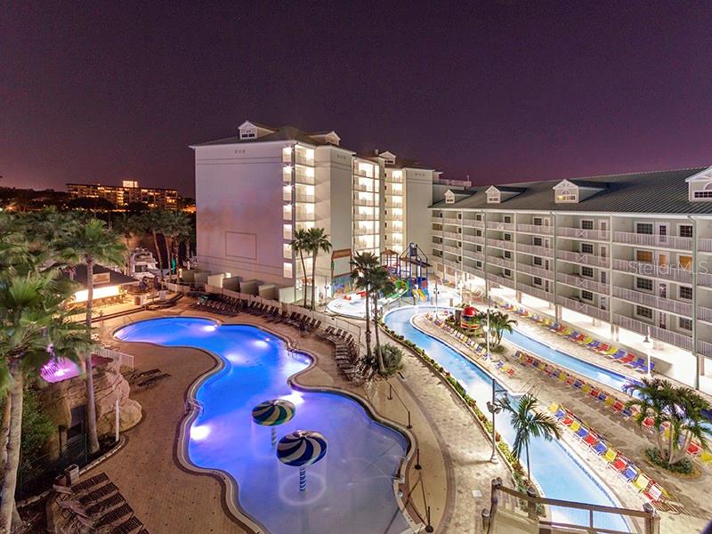 399 2nd Street, Unit 818 Indian Rocks Beach, FL 33785 - Photo 1 of 1 a view of a swimming pool with outdoor seating