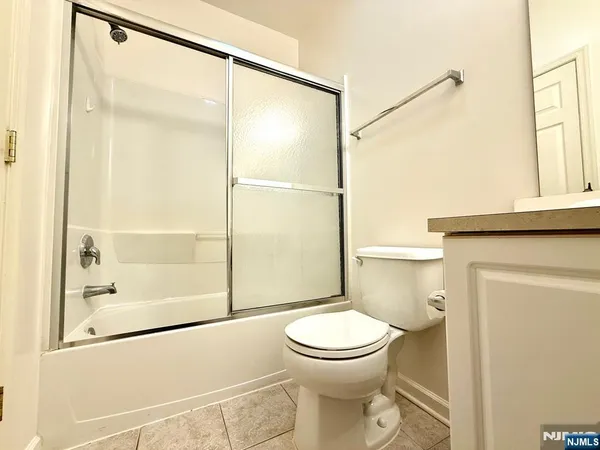 a bathroom with a toilet and shower