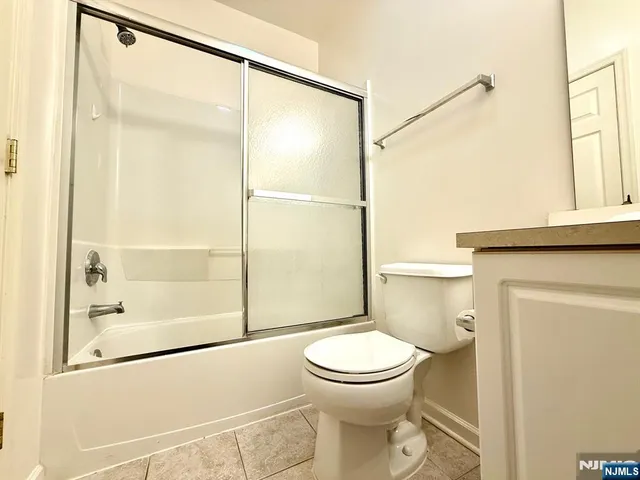a bathroom with a toilet and shower