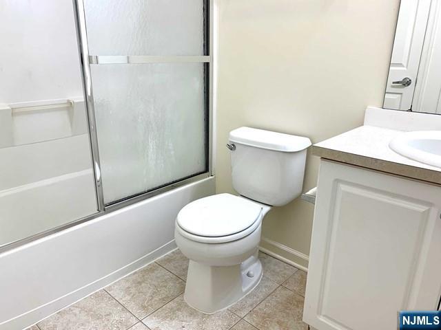 201 Dey Street, Unit 162 Harrison, NJ 07029 - Photo 11 of 21 a white toilet sitting next to a bathroom sink