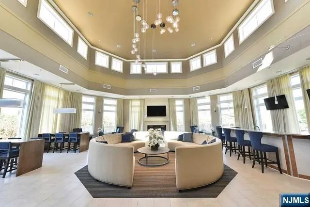 a dining room with wooden floor and furniture