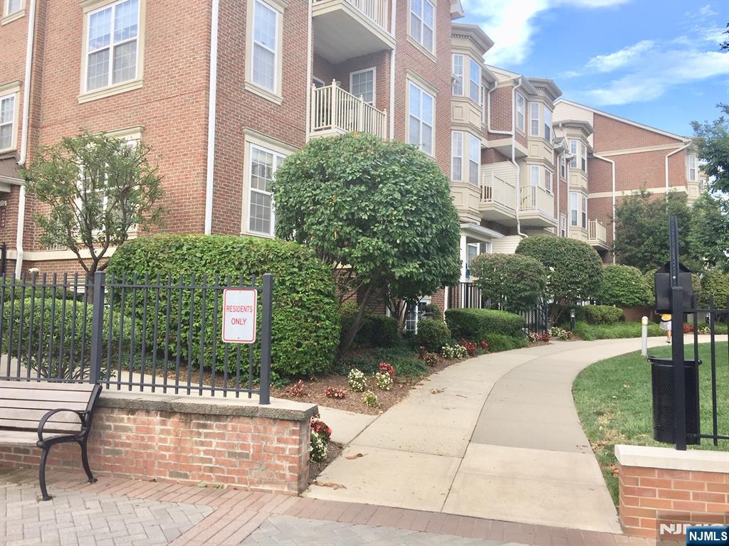 201 Dey Street, Unit 162 Harrison, NJ 07029 - Photo 18 of 21 a view of a building with garden
