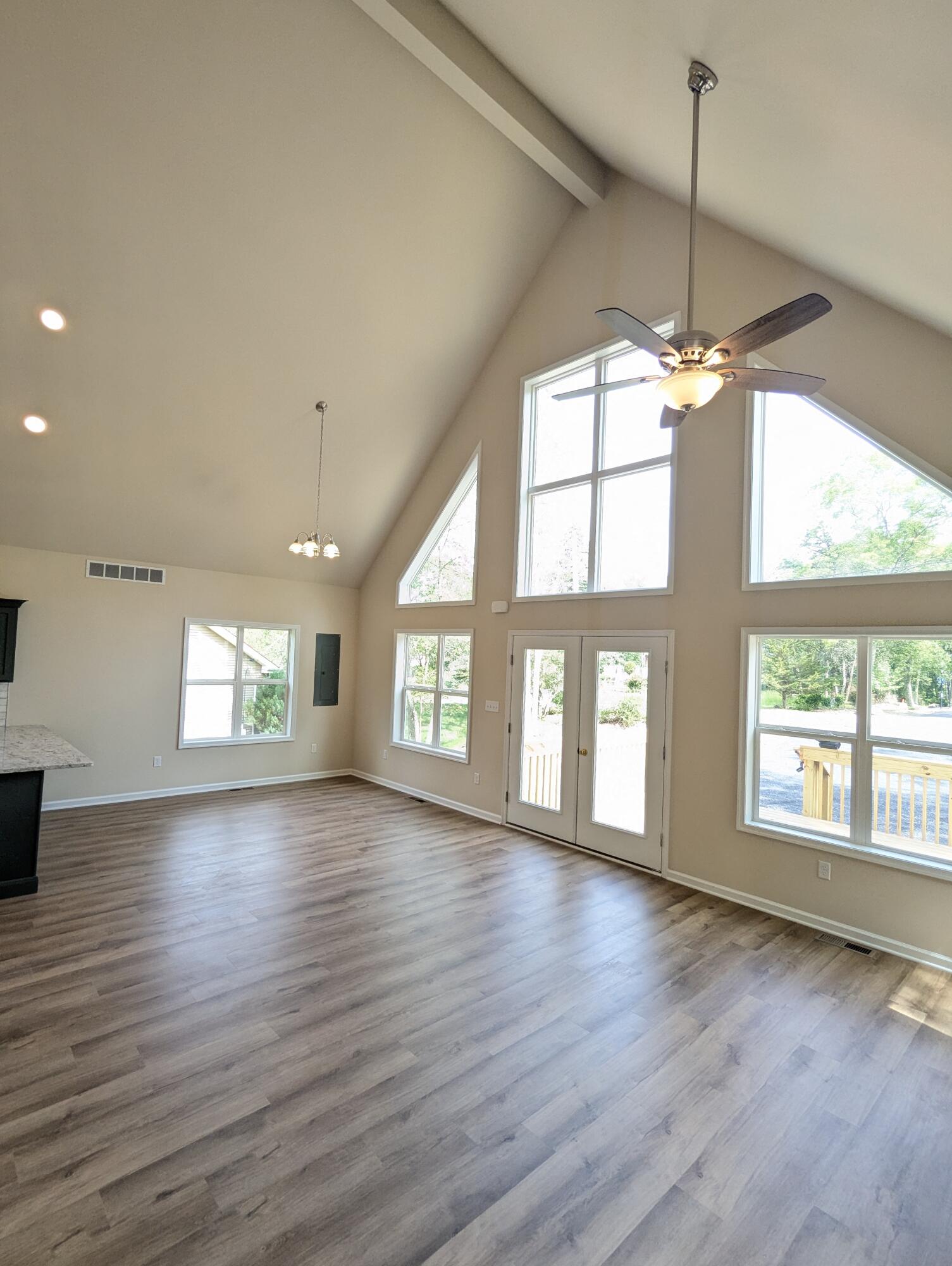 251 Bellingham Drive Bushkill, PA 18324 - Photo 19 of 53 an empty room with wooden floor and windows