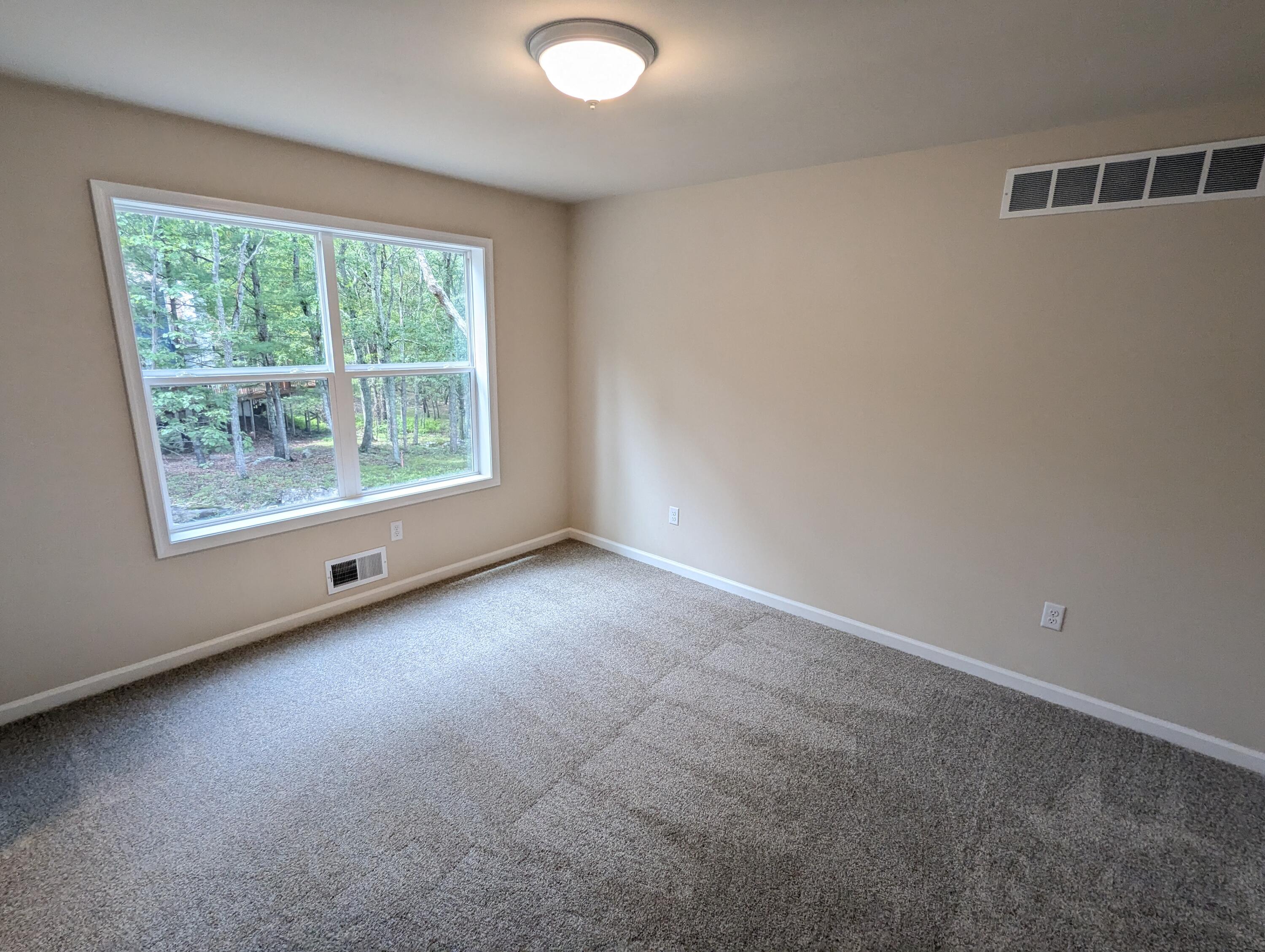 251 Bellingham Drive Bushkill, PA 18324 - Photo 26 of 53 an empty room with a window