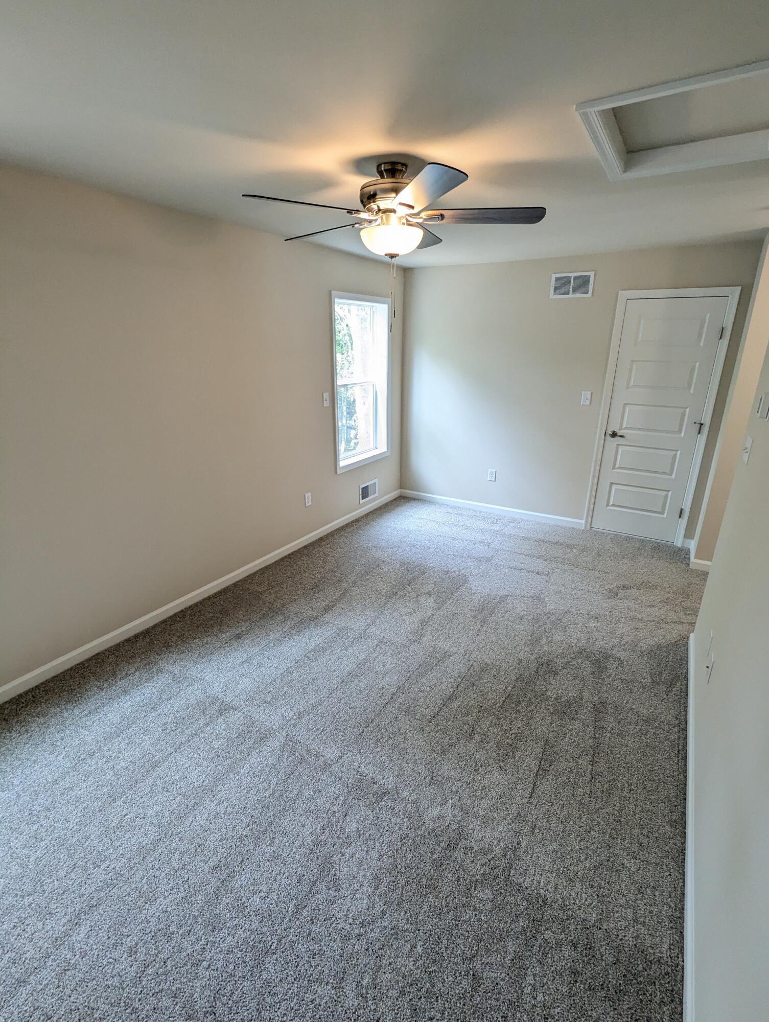 251 Bellingham Drive Bushkill, PA 18324 - Photo 10 of 53 a view of an empty room with a window