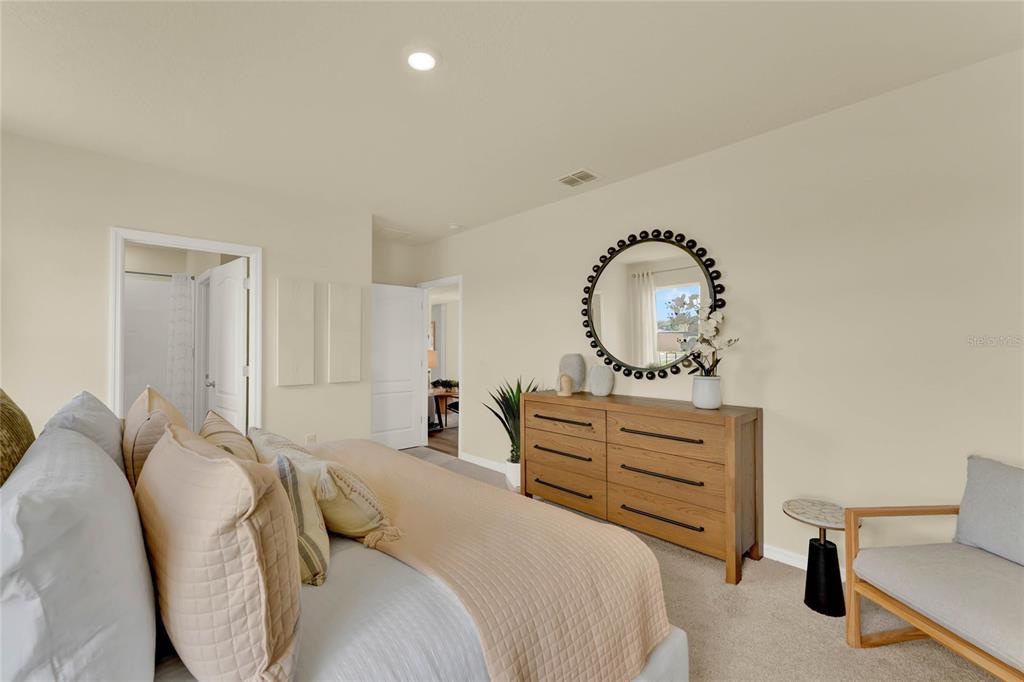 5220 Flameleaf Street Apopka, FL 32712 - Photo 27 of 30 a bedroom with a bed and a dresser