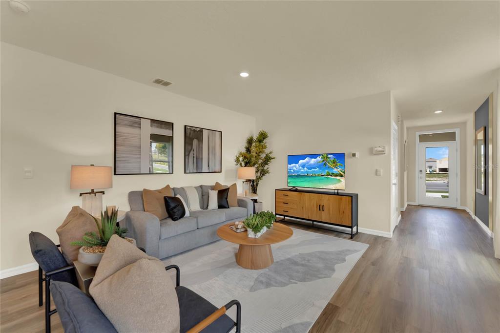 5220 Flameleaf Street Apopka, FL 32712 - Photo 5 of 30 a living room with furniture and a flat screen tv