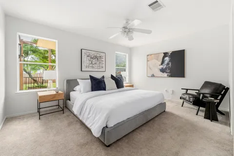 a bedroom with bed and window with window