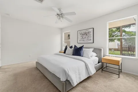 a bed room with a bed and a window