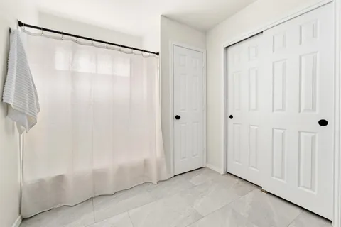 a view of a bathroom with a shower