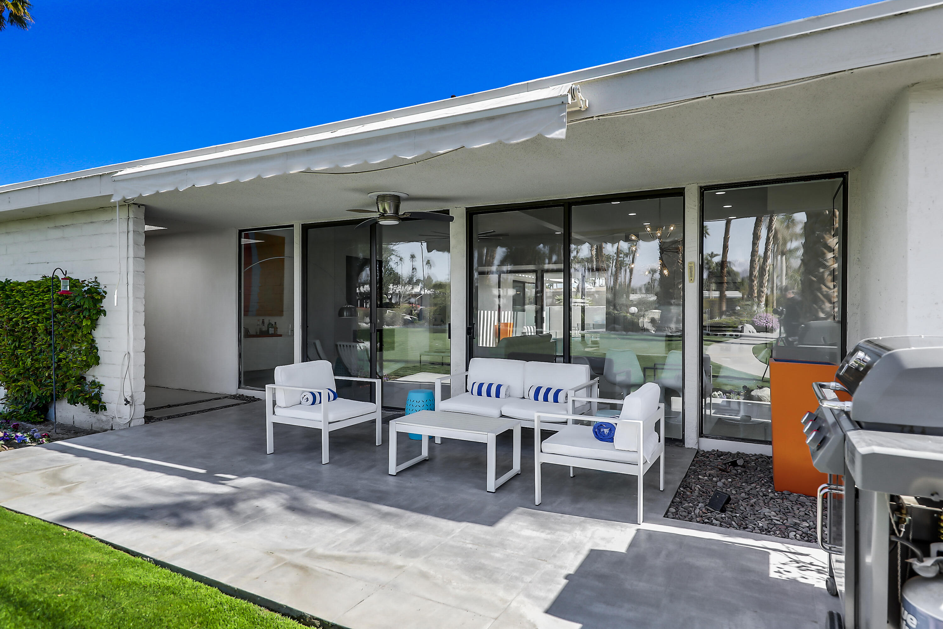 45765 Hopi Road Indian Wells, CA 92210 - Photo 14 of 39 a patio with table and chairs and potted plants