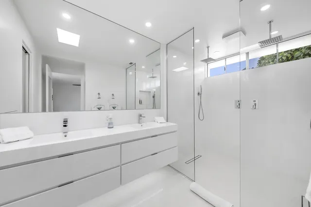 a bathroom with a bathtub and shower